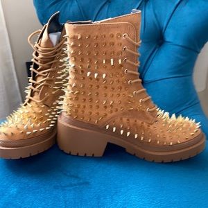 Assassin Cape Robbin Spiked military boots.